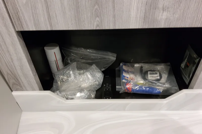  Yacht Photos Pics Storage compartment with various items in a 2026 Formula 380 Super Sport Crossover OB.