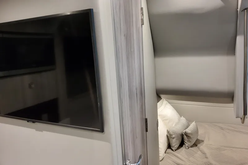  Yacht Photos Pics Interior of 2026 Formula 380 Super Sport Crossover OB with TV and cozy bed.