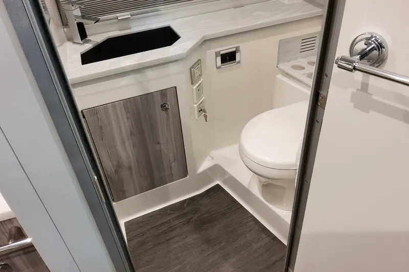  Yacht Photos Pics 2026 Formula 380 Super Sport Crossover OB bathroom with modern fixtures and wood accents.