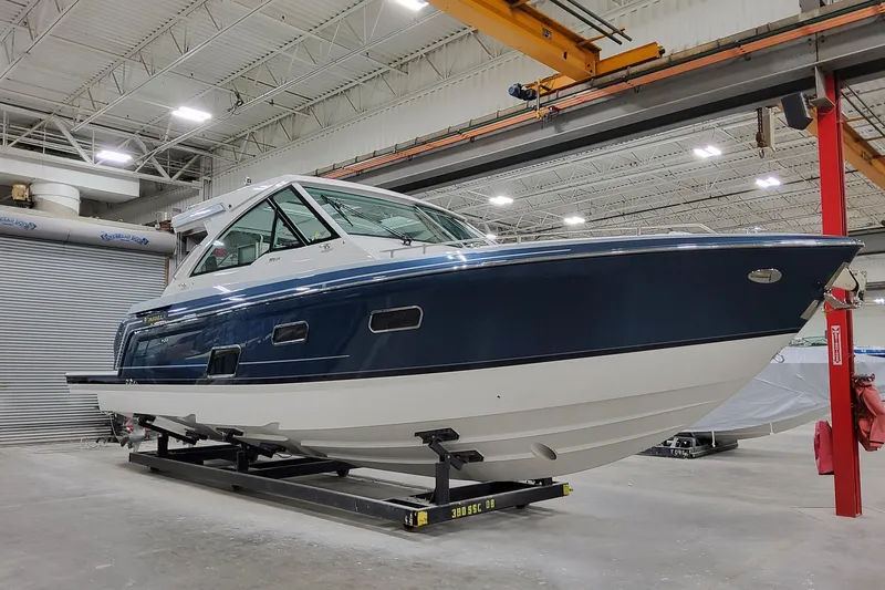  Yacht Photos Pics 2026 Formula 380 Super Sport Crossover OB in a showroom, showcasing sleek design.