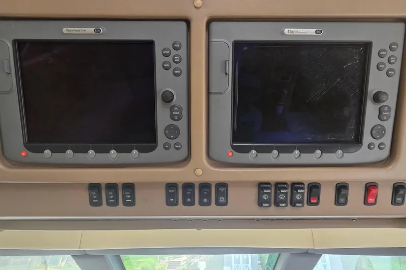 Mardi Gras Yacht Photos Pics Control panel of a 2006 Carver 56 Voyager yacht with Raymarine displays.