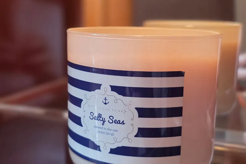 Mardi Gras Yacht Photos Pics Candle labeled "Salty Seas" with nautical stripes, reflecting a maritime theme.