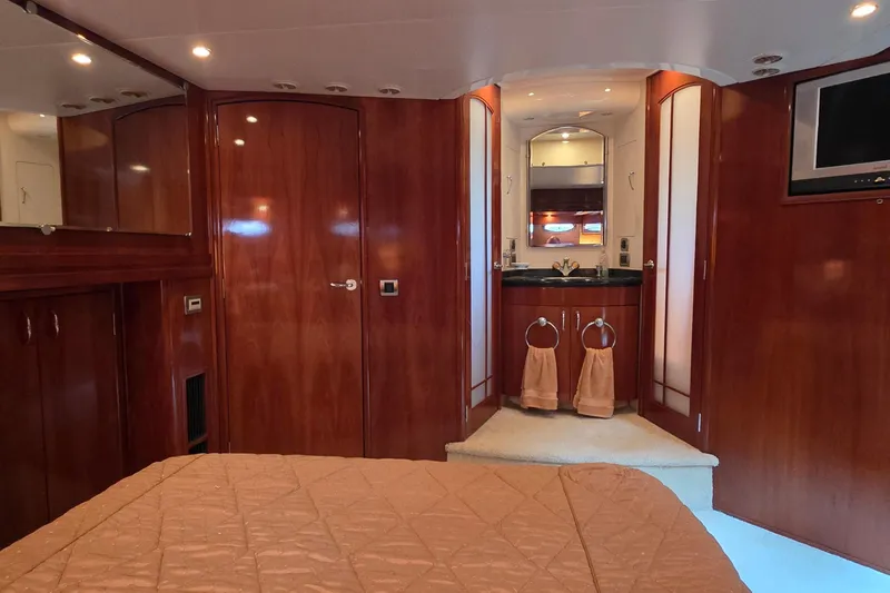 Mardi Gras Yacht Photos Pics Luxurious interior of 2006 Carver 56 Voyager yacht with wood paneling and elegant furnishings.