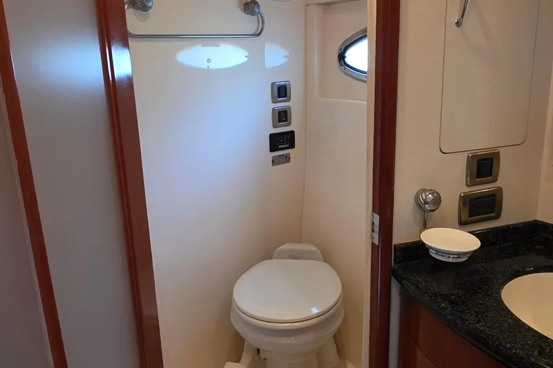 Mardi Gras Yacht Photos Pics 2006 Carver 56 Voyager yacht bathroom with modern fixtures and compact design.