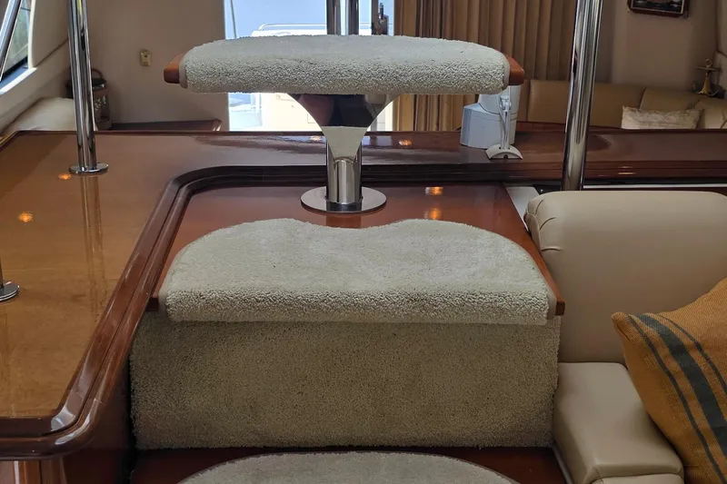 Mardi Gras Yacht Photos Pics Interior of 2006 Carver 56 Voyager yacht with carpeted steps and elegant wood finish.