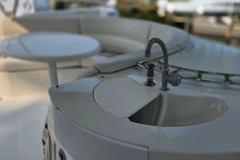 Mardi Gras Yacht Photos Pics 2006 Carver 56 Voyager yacht deck with sink and seating area.