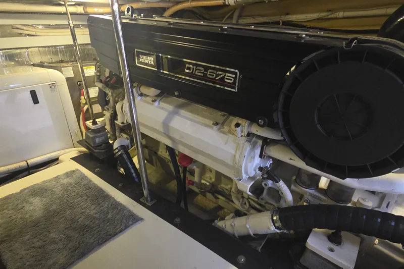 Mardi Gras Yacht Photos Pics Engine room of a 2006 Carver 56 Voyager with Volvo Penta D12-675 engine.
