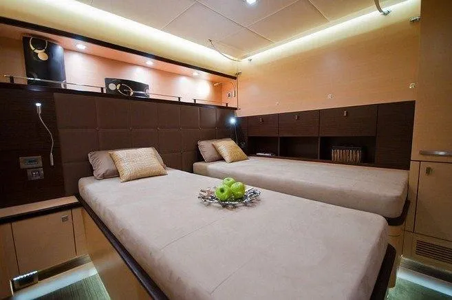 Ipharra Yacht Photos Pics Luxurious cabin interior of 2009 Sunreef 31m yacht with twin beds and elegant decor.
