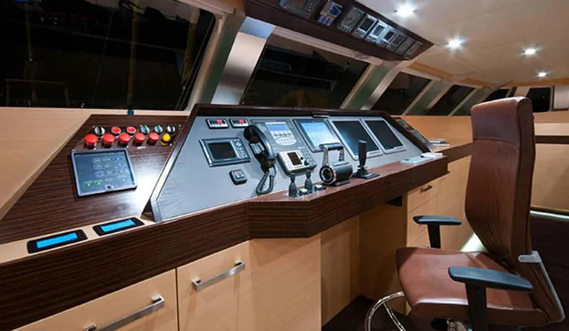 Ipharra Yacht Photos Pics Luxurious Sunreef 31m yacht helm, 2009 model, featuring modern navigation controls and leather captain's chair.