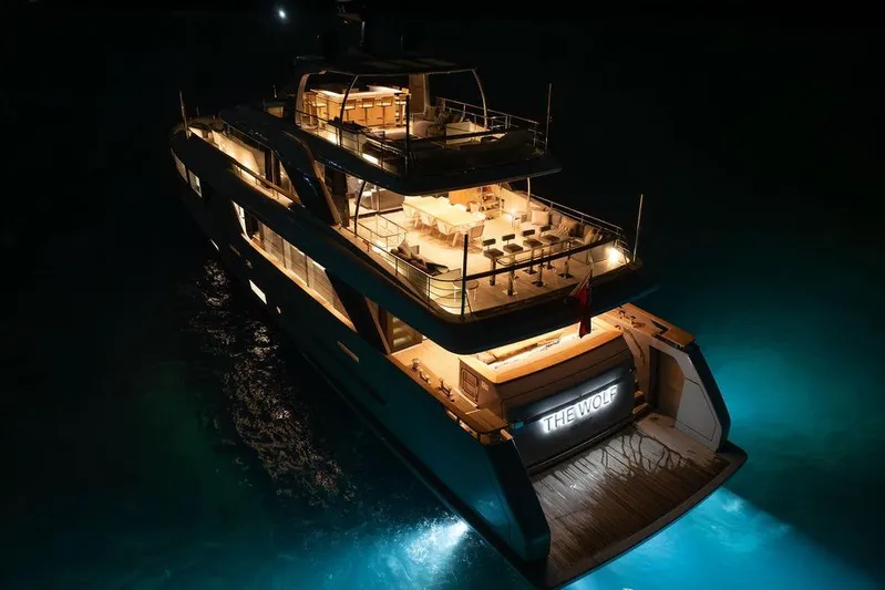 The Wolf Yacht Photos Pics Luxurious 2023 Sanlorenzo SD118 yacht illuminated at night, named "The Wolf."