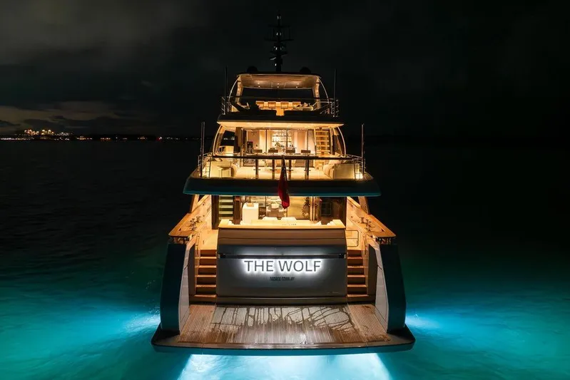 The Wolf Yacht Photos Pics Luxurious 2023 Sanlorenzo SD118 yacht "The Wolf" illuminated at night on the water.