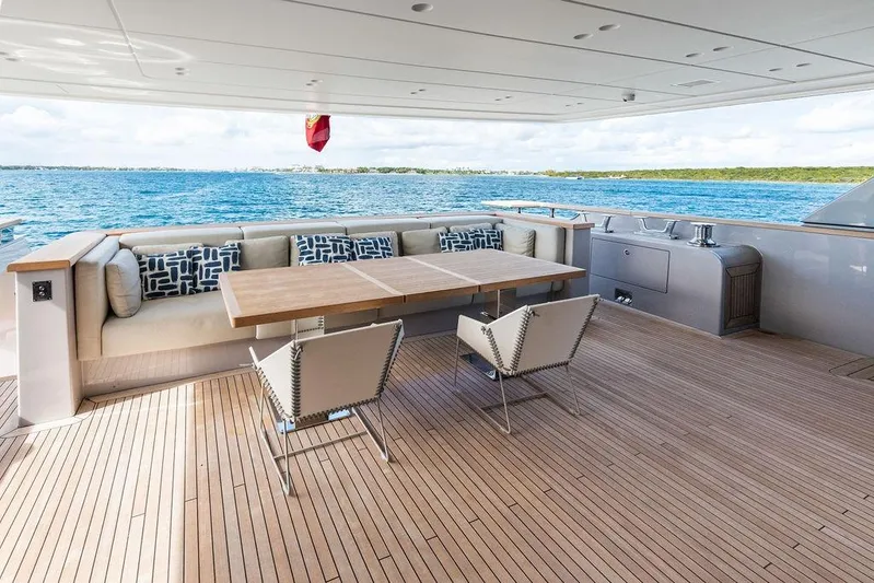 The Wolf Yacht Photos Pics Luxury Sanlorenzo SD118 yacht deck with elegant seating, wooden flooring, and ocean view, 2023 model.