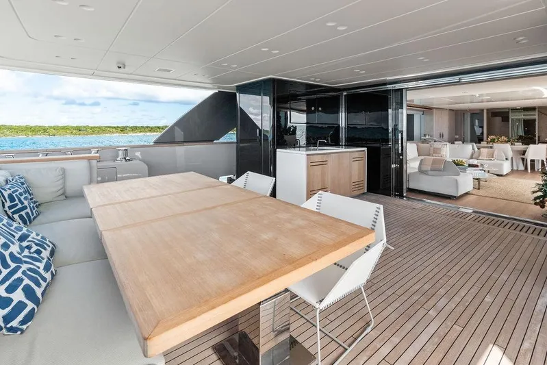 The Wolf Yacht Photos Pics Luxurious 2023 Sanlorenzo SD118 yacht deck with elegant seating and ocean view.