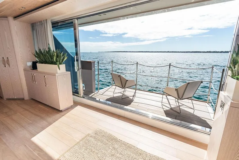 The Wolf Yacht Photos Pics Luxurious Sanlorenzo SD118 yacht interior with ocean view, featuring elegant decor and seating, 2023 model.