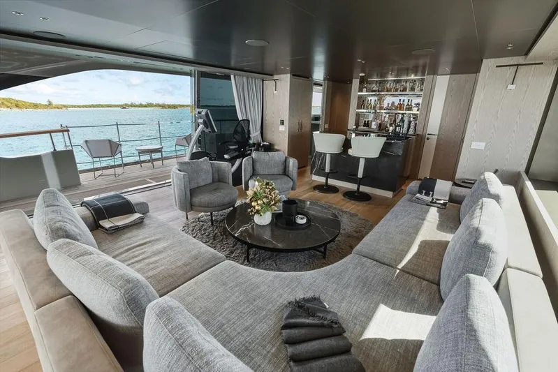 The Wolf Yacht Photos Pics Luxurious interior of 2023 Sanlorenzo SD118 yacht with elegant seating and ocean view.