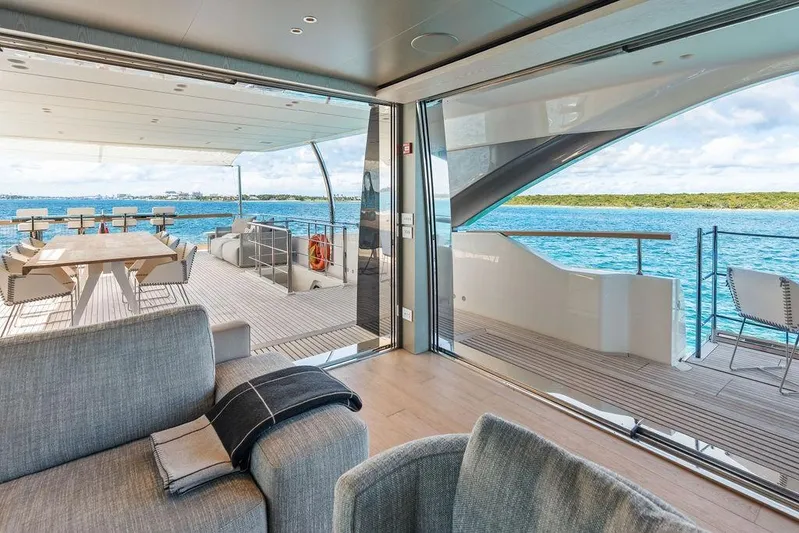 The Wolf Yacht Photos Pics Luxurious 2023 Sanlorenzo SD118 yacht interior with ocean view and elegant deck seating.