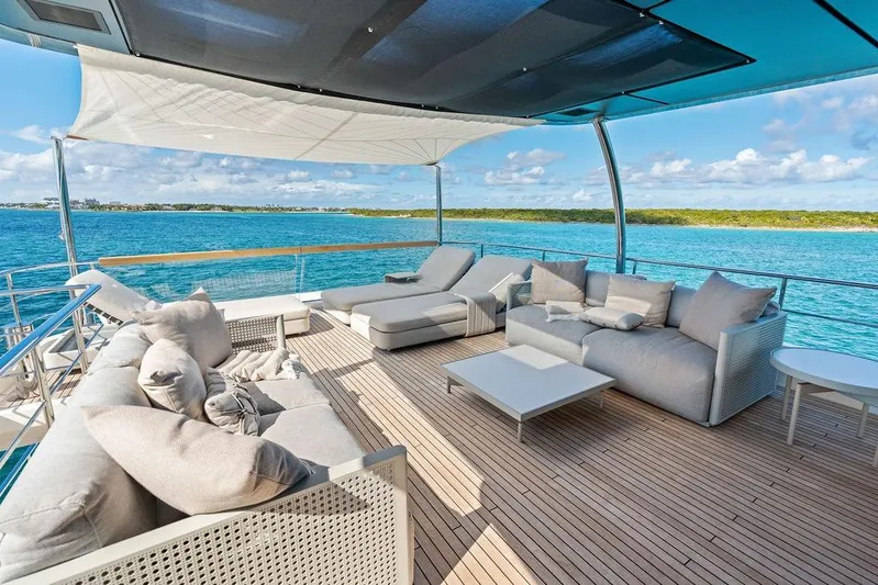 The Wolf Yacht Photos Pics Luxurious 2023 Sanlorenzo SD118 yacht deck with elegant seating and ocean view.