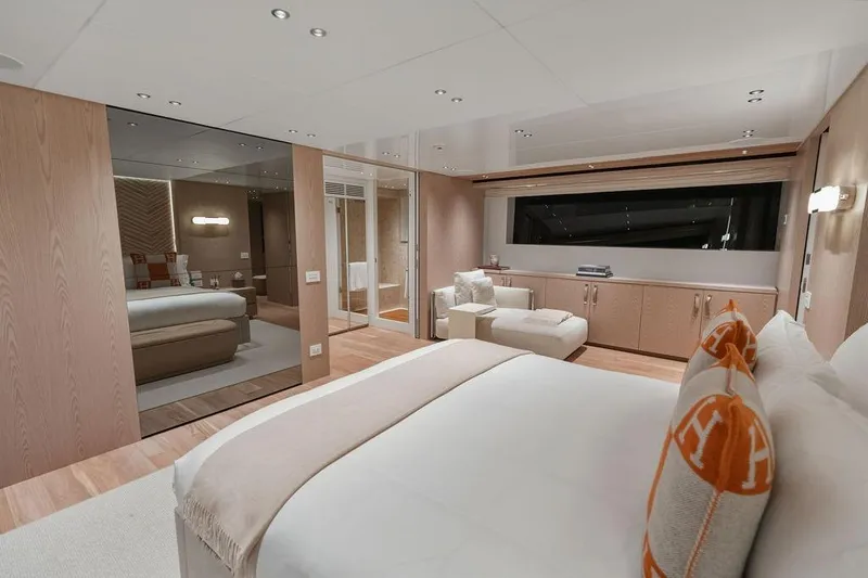 The Wolf Yacht Photos Pics Luxurious Sanlorenzo SD118 2023 yacht bedroom with modern decor and elegant furnishings.