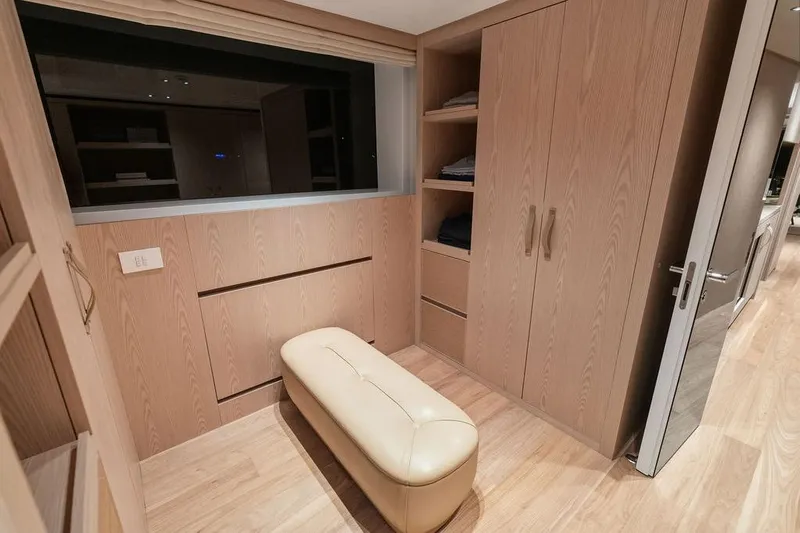 The Wolf Yacht Photos Pics Luxurious interior of 2023 Sanlorenzo SD118 yacht with wooden cabinetry and leather seating.