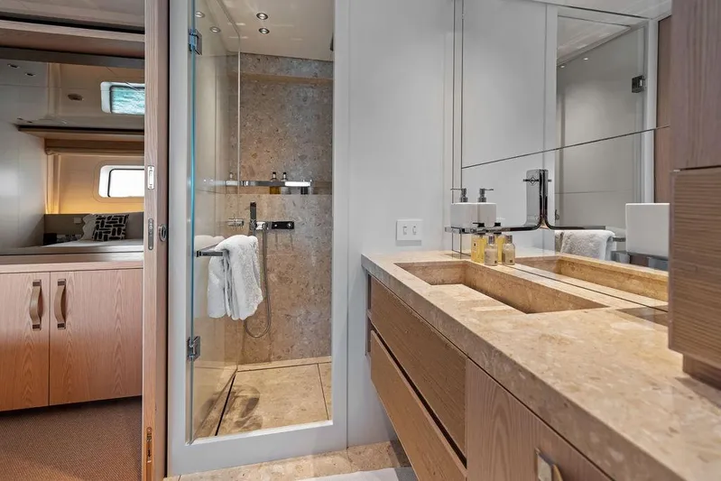 The Wolf Yacht Photos Pics Luxurious bathroom on 2023 Sanlorenzo SD118 yacht with marble countertop and glass shower.