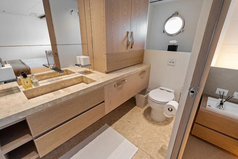 The Wolf Yacht Photos Pics Luxurious bathroom on 2023 Sanlorenzo SD118 yacht with modern fixtures and elegant wood finishes.