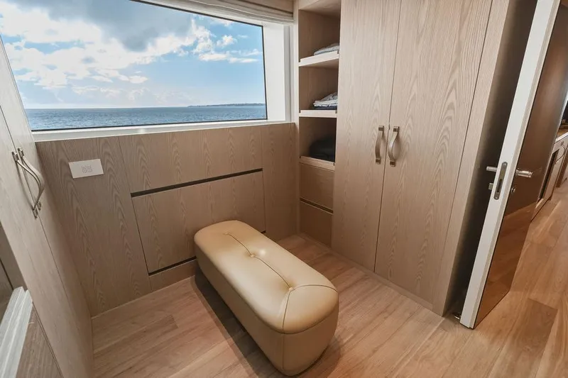 The Wolf Yacht Photos Pics Luxurious 2023 Sanlorenzo SD118 yacht interior with ocean view, featuring elegant wood finishes.