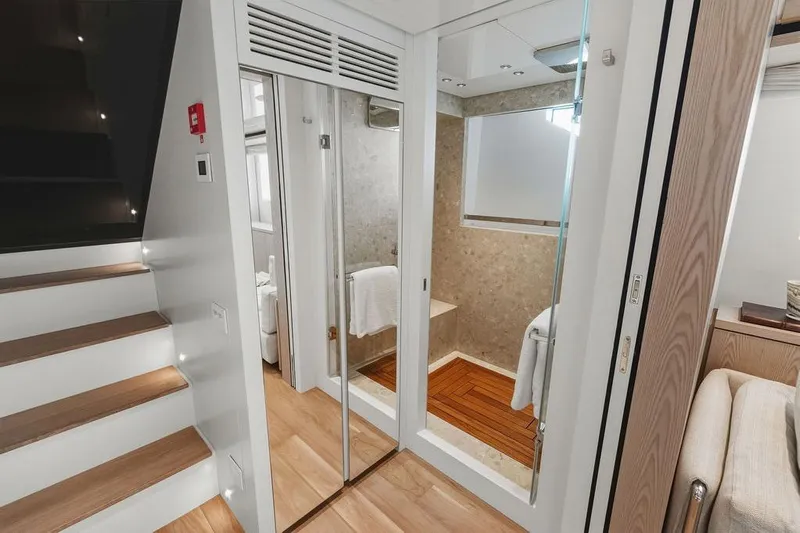 The Wolf Yacht Photos Pics Luxurious interior of 2023 Sanlorenzo SD118 yacht featuring modern staircase and elegant bathroom.