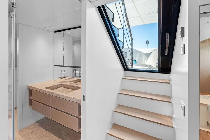 The Wolf Yacht Photos Pics Luxurious interior of 2023 Sanlorenzo SD118 yacht featuring modern bathroom and staircase.