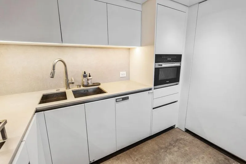 The Wolf Yacht Photos Pics Modern kitchen in 2023 Sanlorenzo SD118 yacht with sleek cabinetry and built-in appliances.