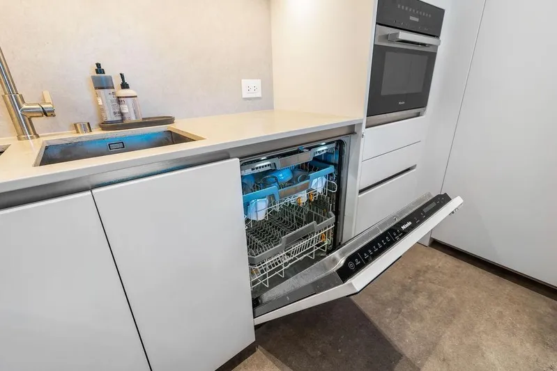 The Wolf Yacht Photos Pics Modern kitchen with open dishwasher on Sanlorenzo SD118 yacht, 2023 model.