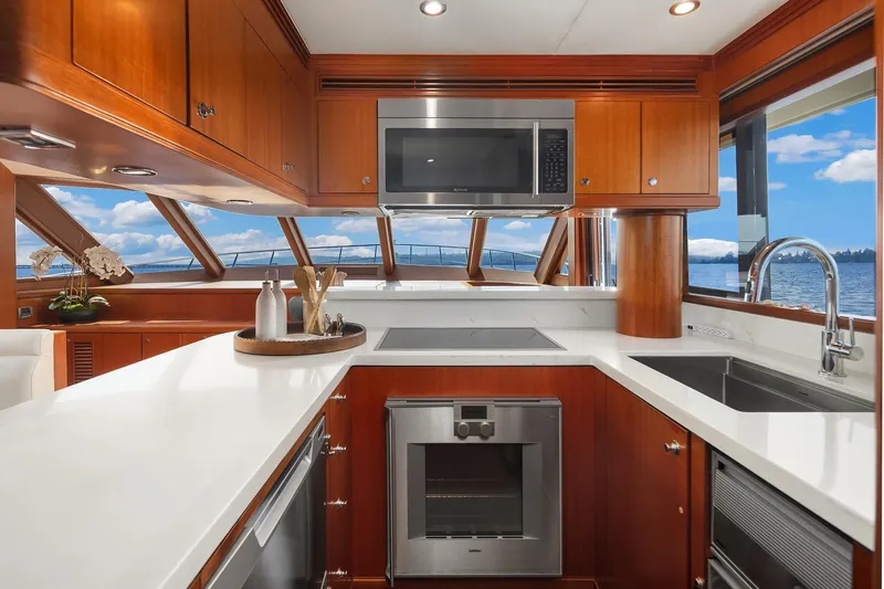 Estancia Yacht Photos Pics Luxurious kitchen interior of 2010 Ocean Alexander 80 Motoryacht with modern appliances and scenic views.