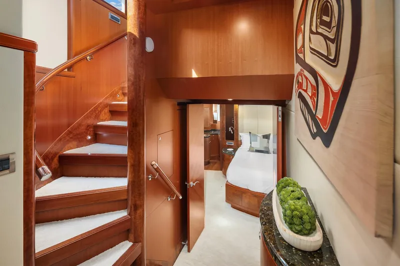 Estancia Yacht Photos Pics Luxurious interior of 2010 Ocean Alexander 80 Motoryacht with elegant staircase and modern decor.