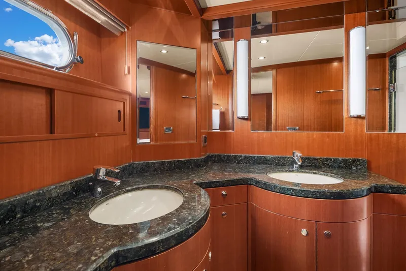 Estancia Yacht Photos Pics Luxurious bathroom in 2010 Ocean Alexander 80 Motoryacht with dual sinks and elegant wood finish.