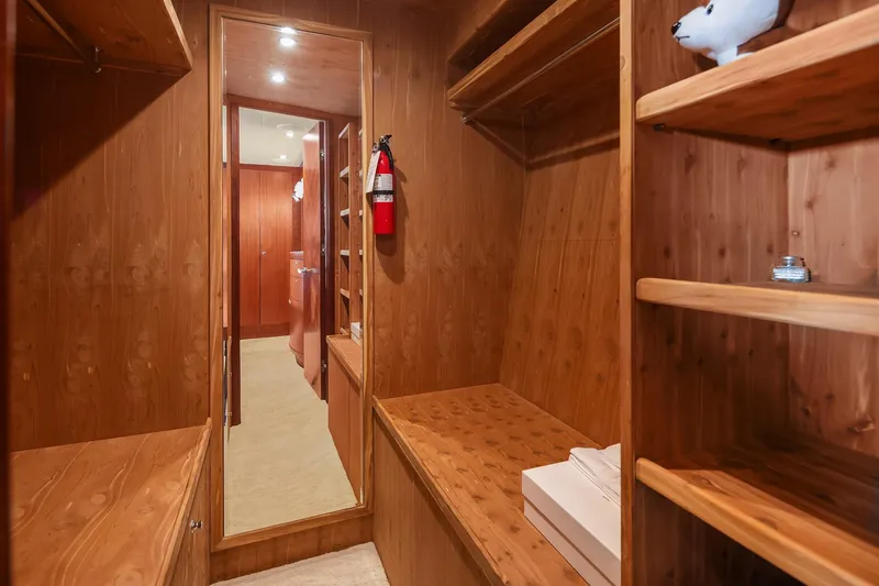 Estancia Yacht Photos Pics Luxurious wooden interior of 2010 Ocean Alexander 80 Motoryacht with shelves and mirror.