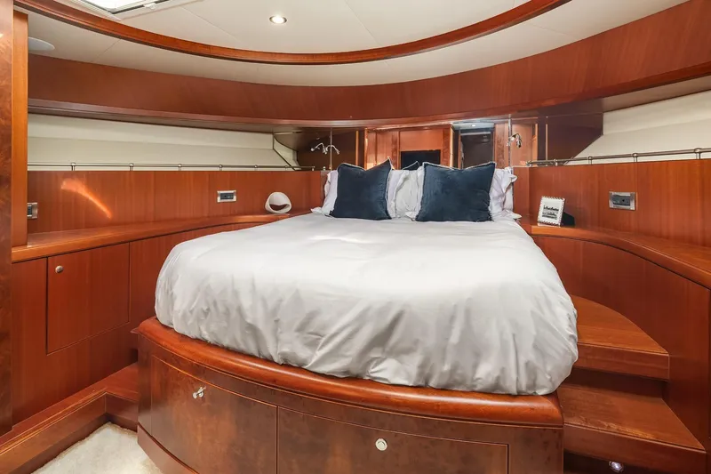 Estancia Yacht Photos Pics Luxurious bedroom interior of 2010 Ocean Alexander 80 Motoryacht with elegant wood finish.