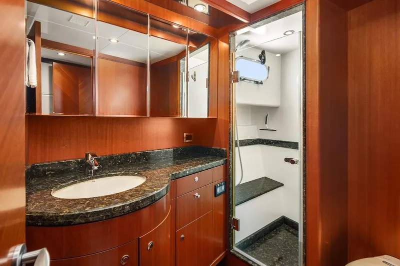 Estancia Yacht Photos Pics Luxurious bathroom in 2010 Ocean Alexander 80 Motoryacht with wood cabinetry and marble accents.