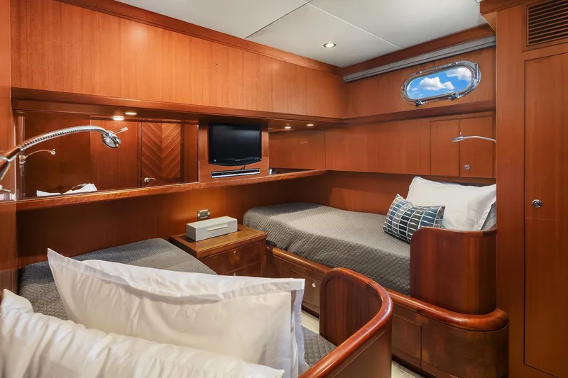 Estancia Yacht Photos Pics Luxurious cabin interior of 2010 Ocean Alexander 80 Motoryacht with twin beds and wood finish.