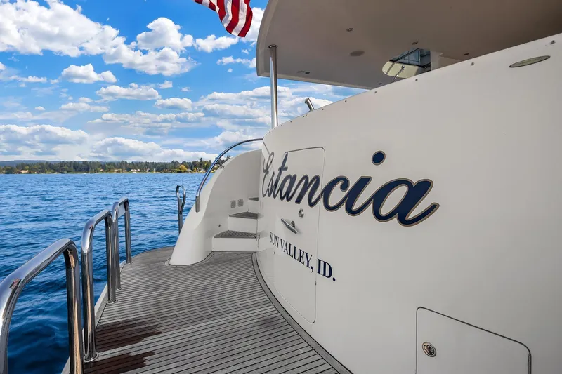 Estancia Yacht Photos Pics Ocean Alexander 80 Motoryacht 2010 on serene blue water under a vibrant sky.