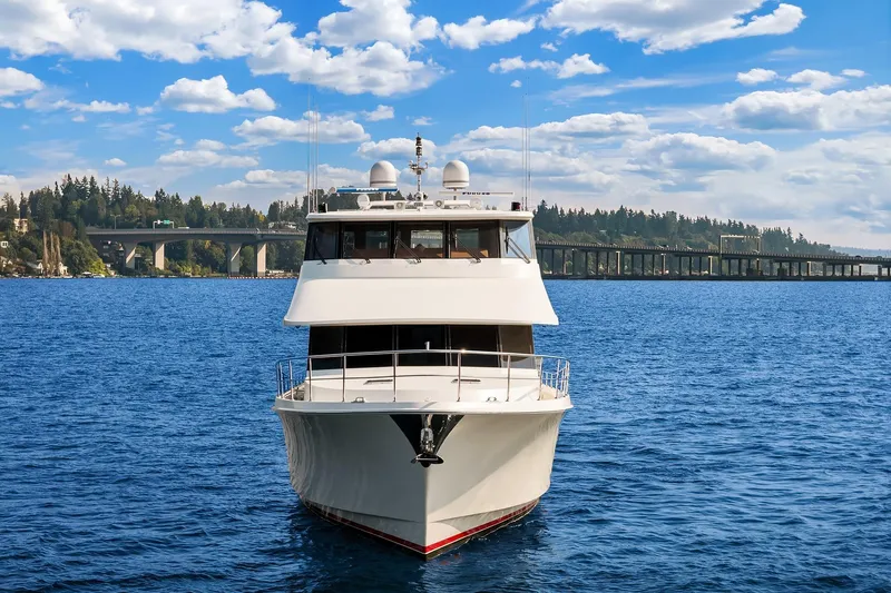 Estancia Yacht Photos Pics 2010 Ocean Alexander 80 Motoryacht on blue water, bridge and trees in background.