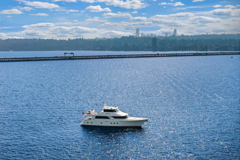 Estancia Yacht Photos Pics Luxurious 2010 Ocean Alexander 80 Motoryacht cruising on a sparkling blue lake.