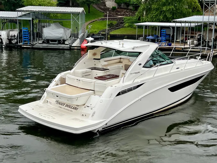  Yacht Photos Pics 2014 Sea Ray 410 Sundancer yacht docked on calm water.