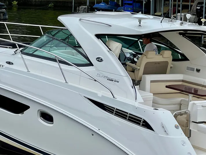  Yacht Photos Pics 2014 Sea Ray 410 Sundancer yacht docked, featuring sleek design and luxurious seating.