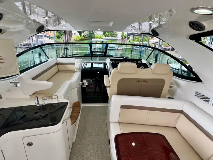  Yacht Photos Pics Luxurious interior of 2014 Sea Ray 410 Sundancer yacht with plush seating and sleek design.