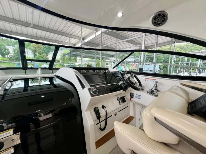  Yacht Photos Pics Interior helm of 2014 Sea Ray 410 Sundancer yacht with modern controls and seating.