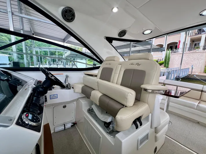  Yacht Photos Pics Interior of 2014 Sea Ray 410 Sundancer yacht with luxurious seating and modern helm controls.