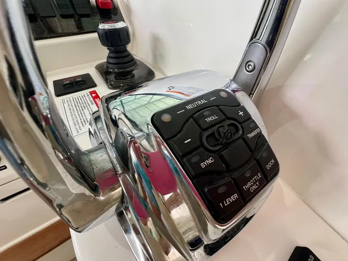  Yacht Photos Pics Control panel of a 2014 Sea Ray 410 Sundancer boat, featuring throttle and joystick controls.