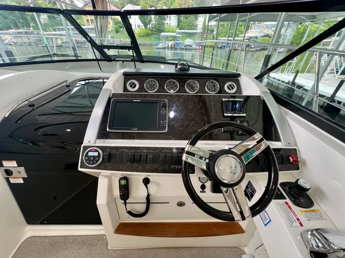  Yacht Photos Pics Helm of 2014 Sea Ray 410 Sundancer with modern controls and navigation system.