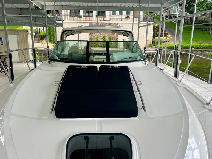  Yacht Photos Pics 2014 Sea Ray 410 Sundancer yacht docked, featuring sleek design and spacious deck.