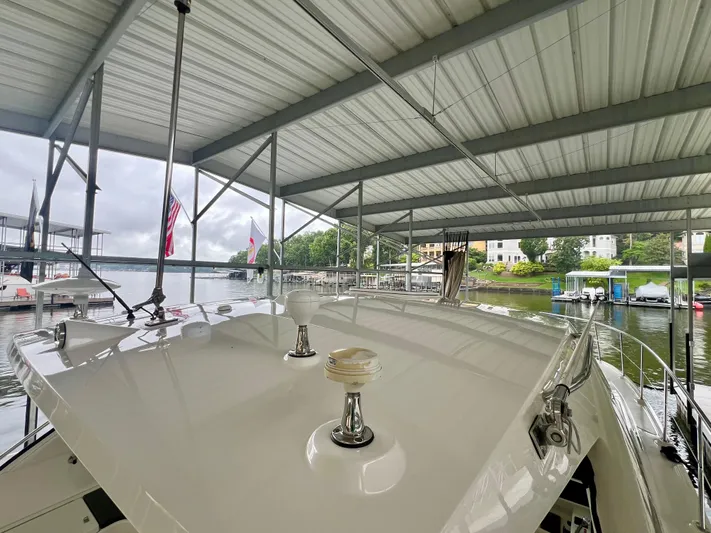  Yacht Photos Pics 2014 Sea Ray 410 Sundancer yacht docked under a covered marina.