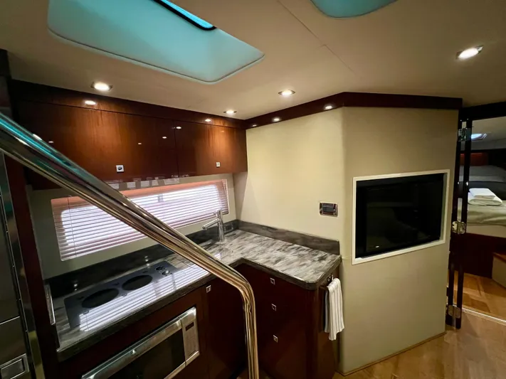  Yacht Photos Pics Luxurious interior of 2014 Sea Ray 410 Sundancer yacht with modern kitchen and sleek design.